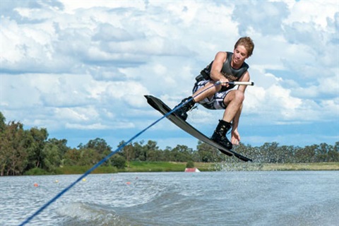 a boy wakeboarding