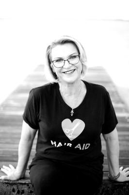 Headshot of Selina Tomasich Australia Day Ambassador black and white photo wearing black tshirt with white heart