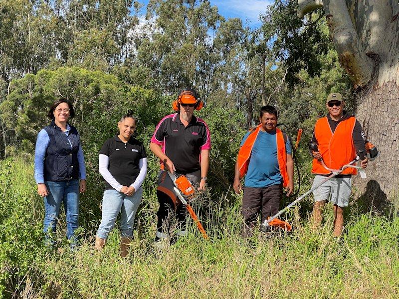 community justice group workers cleaning up the goondiwindi town common
